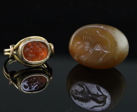 An antique gold and intaglio ring and an intaglio pendant, size H.
